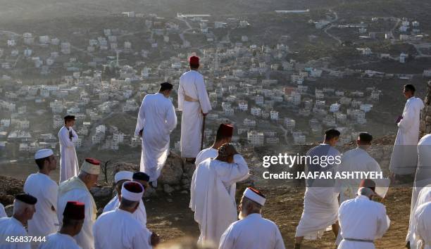 Samaritans take part in the celebrations marking the holiday of Sukkot on Mount Gerizim, near the northern West Bank city of Nablus, on October 8,...