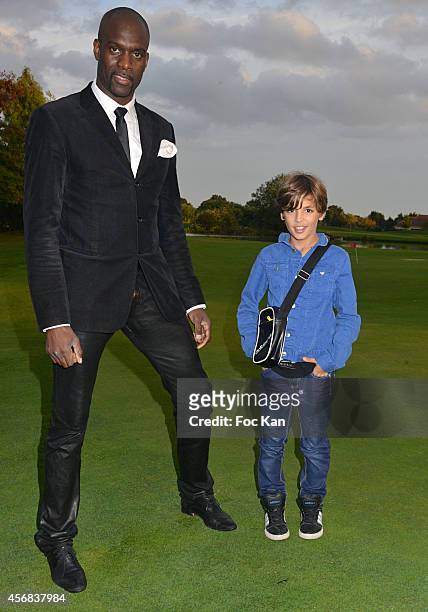 Pascal Gentil and Enzo Tomasini attend the 'Tee Break Gourmand' Auction Golf Competition hosted by Matrix to benefit SOS Gazelles at the Golf d'...