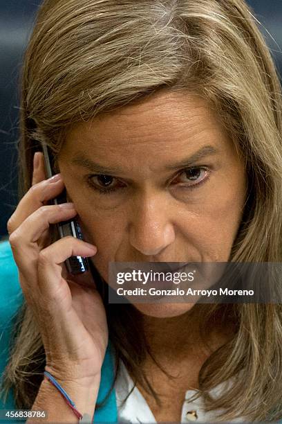 Spanish Health Minister Ana Mato answers a phone call during a plenary session at the Spanish Parliament on October 8, 2014 in Madrid, Spain. Spanish...