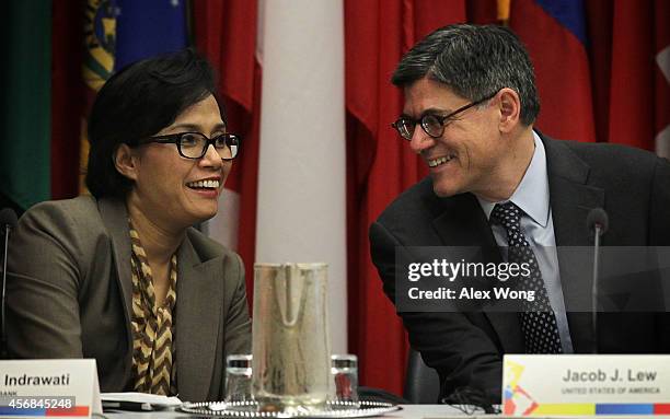 Secretary of the Treasury Jacob Lew talks to Managing Director at the World Bank Sri Mulyani Indrawati prior to a session at the Sixth Meeting of...