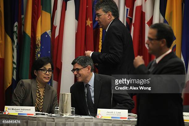 Secretary of the Treasury Jacob Lew talks to Managing Director at the World Bank Sri Mulyani Indrawati as Minister of Finance and Public Credit of...