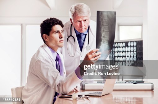 Doctors working in office at X-ray clinic Doctors working in office at X-ray clinic