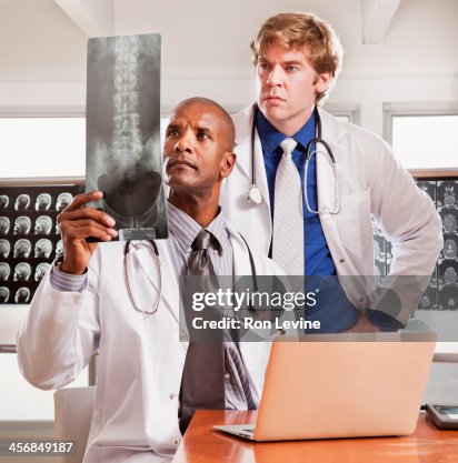 Doctors working in office at X-ray clinic Doctors working in office at X-ray clinic