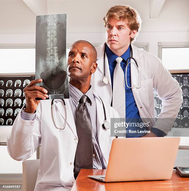 doctors working in office at x-ray clinic - 49 x 39 stock pictures, royalty-free photos & images