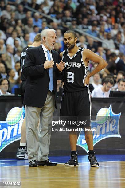 Tony Parker and Gregg Popovich of the San Antonio Spurs talk against Alber Berlin during a game as part of the 2014 Global Games on October 8, 2014...