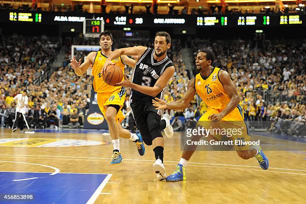 Marco Belinelli of the San Antonio Spurs drives against Alber Berlin during a game as part of the 2014 Global Games on October 8, 2014 at the O2...