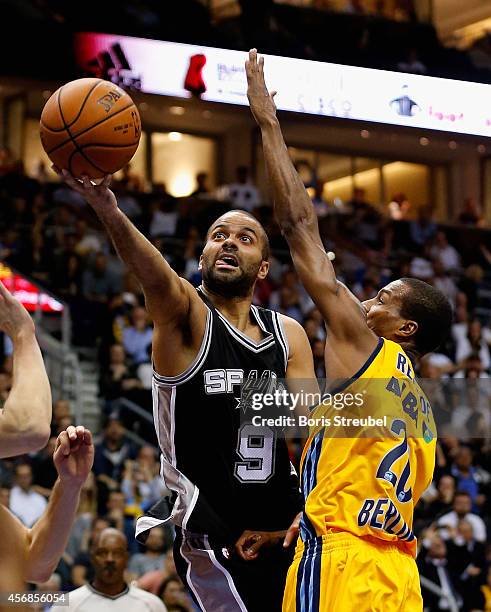 Tony Parker of San Antonio is challenged by Alex Renfroe of Berlin during the NBA Global Games Tour 2014 match between Alba Berlin and San Antonio...