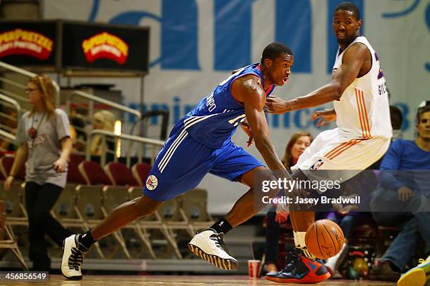 Thanasis Antetokounmpo of the Delaware 87ers drives against Augustus Gilchrist of the Iowa Energy in an NBA D-League game on December 14, 2013 at the...