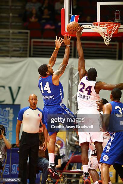 Dustin Salisbery of the Delaware 87ers shoots against Augustus Gilchrist of the Iowa Energy in an NBA D-League game on December 14, 2013 at the Wells...