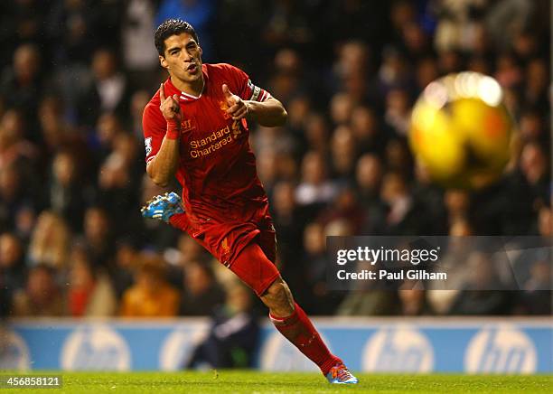 Luis Suarez of Liverpool celebrates scoring their fourth goal during the Barclays Premier League match between Tottenham Hotspur and Liverpool at...