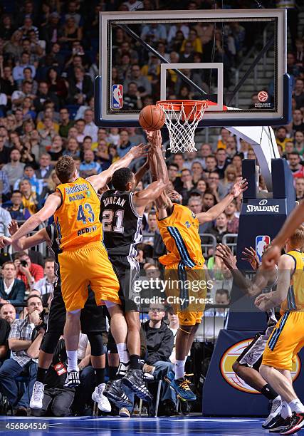 Leon Radosevic of ALBA Berlin, Tim Duncan of San Antonio Spurs and Reggie Redding of ALBA Berlin during the NBA Global Games Tour 2014 match between...