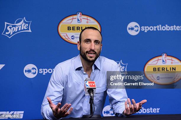 Manu Ginobili of the San Antonio Spurs talks to the media following a game against Alba Berlin as part of the 2014 Global Games on October 8, 2014 at...