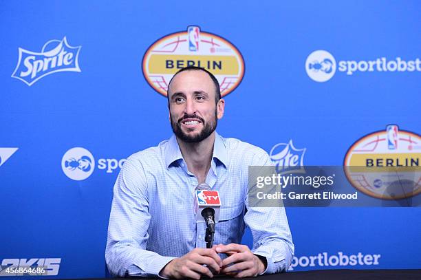 Manu Ginobili of the San Antonio Spurs talks to the media following a game against Alba Berlin during a game as part of the 2014 Global Games on...