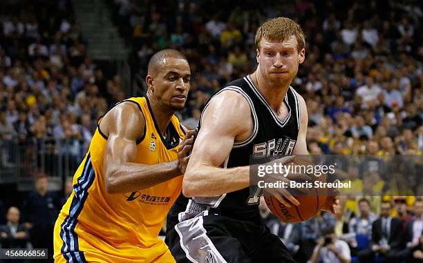 Matt Bonner of San Antonio is challenged by Alex King of Berlin during the NBA Global Games Tour 2014 match between Alba Berlin and San Antonio Spurs...