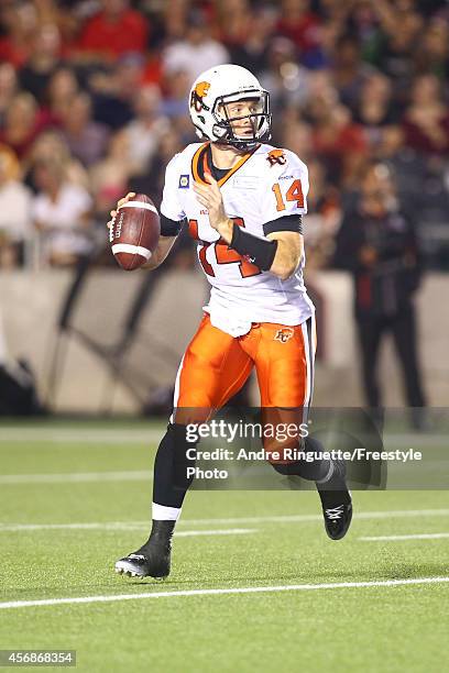 Quarterback Travis Lulay of the BC Lions passes the ball against the Ottawa Redblacks during a CFL game at TD Place Stadium on October 8, 2014 in...