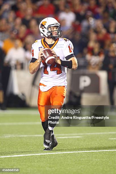 Quarterback Travis Lulay of the BC Lions passes the ball against the Ottawa Redblacks during a CFL game at TD Place Stadium on October 8, 2014 in...