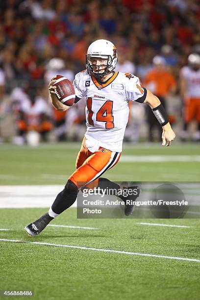 Quarterback Travis Lulay of the BC Lions rushes against the Ottawa Redblacks during a CFL game at TD Place Stadium on October 8, 2014 in Ottawa,...