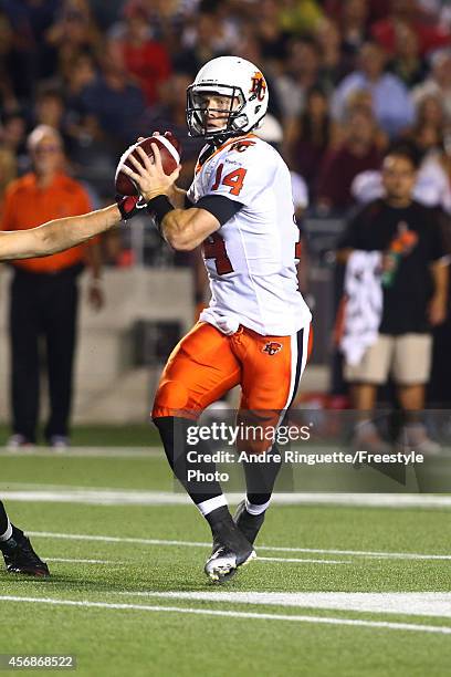 Quarterback Travis Lulay of the BC Lions passes the ball against the Ottawa Redblacks during a CFL game at TD Place Stadium on October 8, 2014 in...