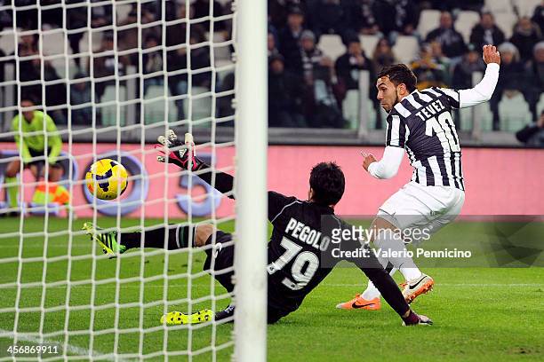 Carlos Tevez of Juventus scores the opening goal during the Serie A match between Juventus and US Sassuolo Calcio at Juventus Arena on December 15,...