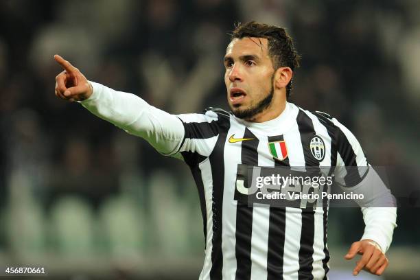 Carlos Tevez of Juventus celebrates his second goal during the Serie A match between Juventus and US Sassuolo Calcio at Juventus Arena on December...