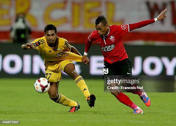 Mohammad Jamal of Al Wasl compete for the ball with Jociel Ferreira da Silva of Al Ahli during the Arabian Gulf League match between Al Wasl Club and...