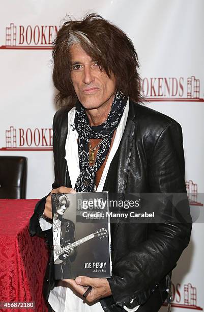 Joe Perry of Aerosmith signs copies of his new book "Rocks" at Bookends Bookstore on October 8, 2014 in Ridgewood, New Jersey.