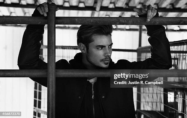 Actor Josh Henderson is photographed for Just Jared on August 13, 2014 in Los Angeles, California.