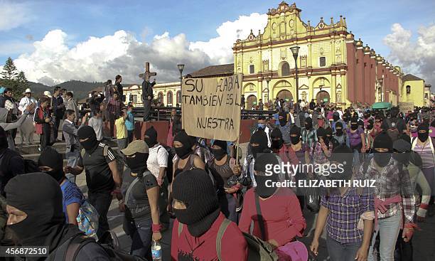 Hundreds of Zapatista militias march during a demostration on October 8, 2014 in San Cristobal de las Casas, Chiapas state, to demand justice in the...
