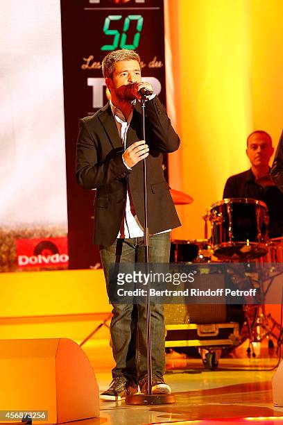 Singer Gregoire perform Richard Cocciantes Song 'Coup de Soleil' during the 'Vivement Dimanche' show at Pavillon Gabriel on October 8, 2014 in Paris,...