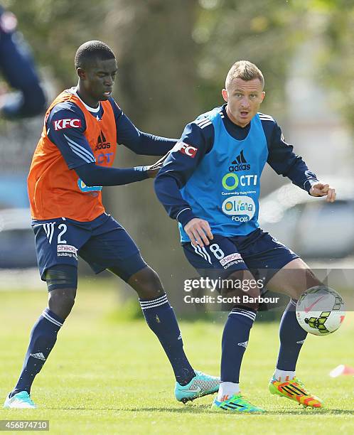 Besart Berisha and Jason Geria compete for the ball during a Melbourne Victory A-League training session at Gosch's Paddock on October 9, 2014 in...