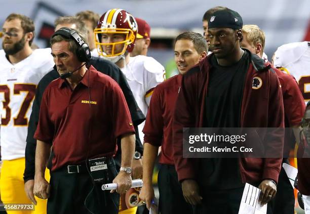 Head coach Mike Shanahan and Robert Griffin III of the Washington Redskins watch a field goal attempt in the final seconds of the first half against...