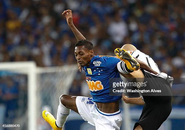 Marquinhos of Cruzeiro struggles for the ball with Fabio Santos of Corinthians during a match between Cruzeiro and Corinthians as part of Brasileirao...