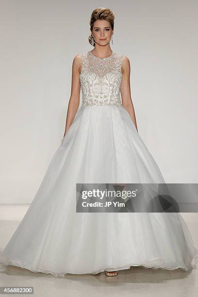 Model walks the runway at the Alfred Angelo Spring 2015 Bridal Collection at EZ Studios on October 8, 2014 in New York City.