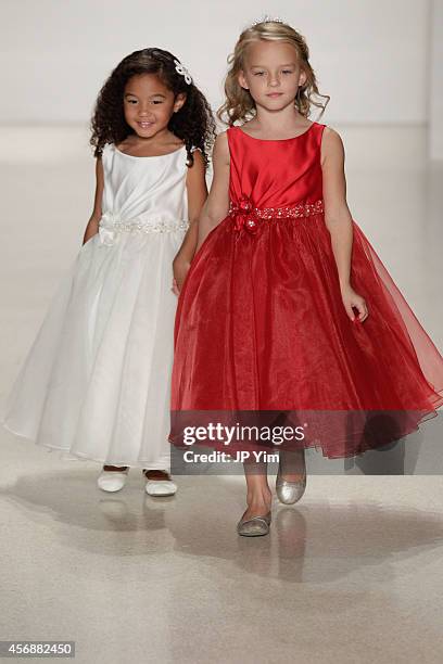 Model walks the runway wearing Disney Fairy Tale Weddings by Alfred Angelo Collection at EZ Studios on October 8, 2014 in New York City.