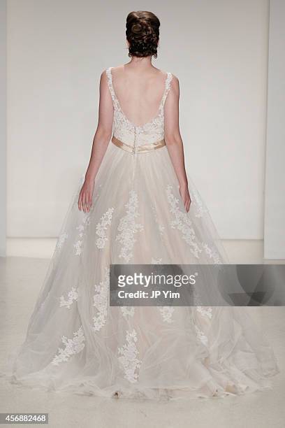 Model walks the runway at the Alfred Angelo Spring 2015 Bridal Collection at EZ Studios on October 8, 2014 in New York City.