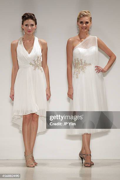 Models walk the runway wearing Disney Fairy Tale Weddings by Alfred Angelo Collection at EZ Studios on October 8, 2014 in New York City.
