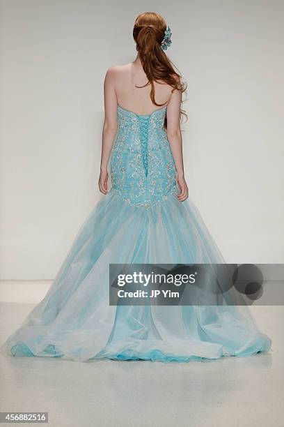 Model walks the runway wearing Disney Fairy Tale Weddings by Alfred Angelo Collection at EZ Studios on October 8, 2014 in New York City.