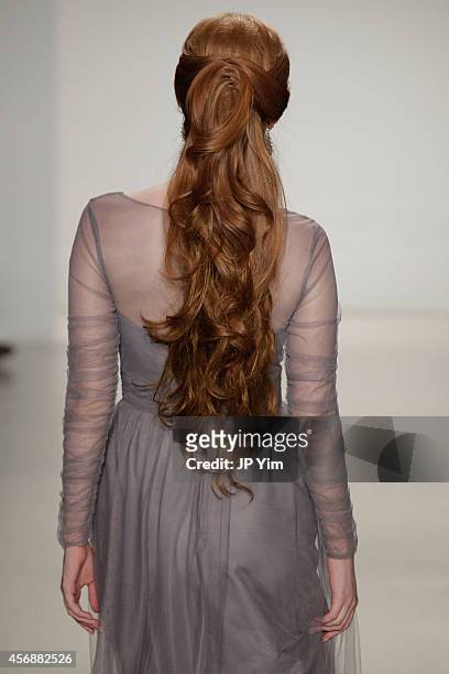 Model walks the runway at the Alfred Angelo Spring 2015 Bridal Collection at EZ Studios on October 8, 2014 in New York City.