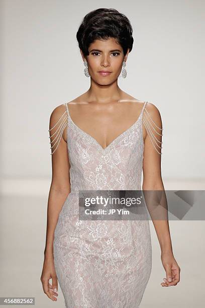 Model walks the runway at the Alfred Angelo Spring 2015 Bridal Collection at EZ Studios on October 8, 2014 in New York City.