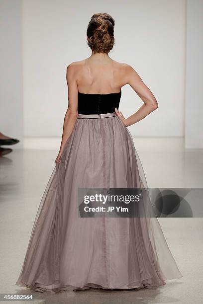 Model walks the runway at the Alfred Angelo Spring 2015 Bridal Collection at EZ Studios on October 8, 2014 in New York City.