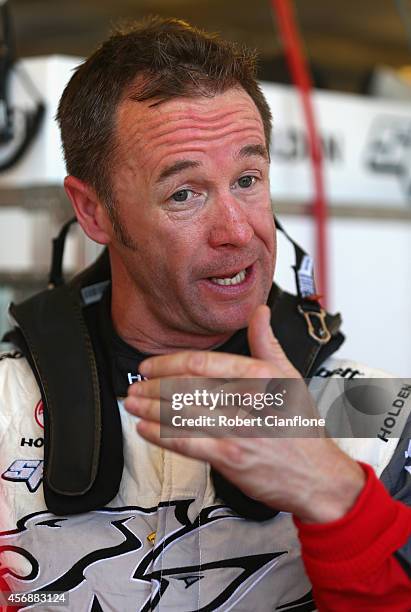 Greg Murphy driver of the Holden Racing Team Holden talks to his crew after practice for the Bathurst 1000, which is round 11 of the V8 Supercars...