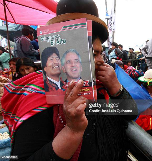 An indigenous Aymara woman supporter of Bolivia's president and presidential candidate of the Socialist Movement, Evo Morales, attends the closing...