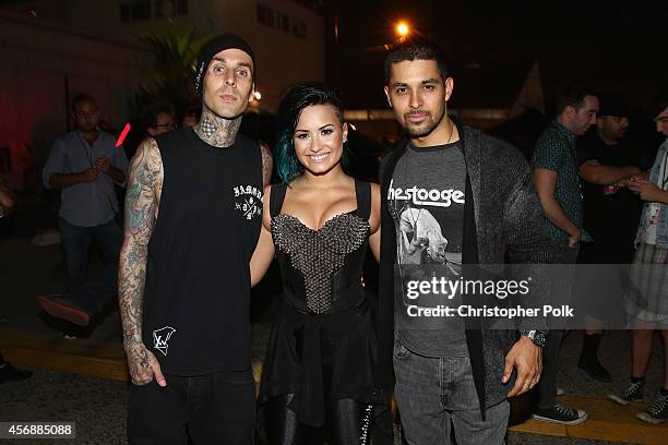 Musician Travis Barker, recording artist Demi Lovato and actor Wilmer Valderrama pose backstage during the Vevo CERTIFIED SuperFanFest presented by...