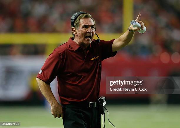 Head coach Mike Shanahan of the Washington Redskins reacts to a call during the game against the Atlanta Falcons at Georgia Dome on December 15, 2013...