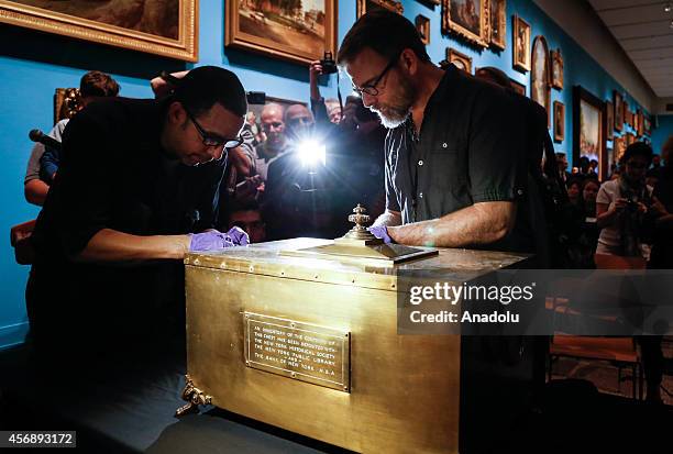 Year-old bronze time capsule, the oldest known and including letters and commercial papers, is locked up with a ceremony in New York, United States...