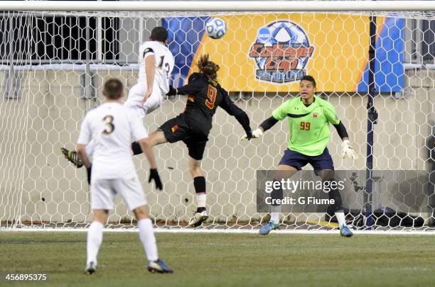 Andrew O'Malley of the Notre Dame Fighting Irish heads the ball into the net for a goal in the second half against Zack Steffen of the Maryland...