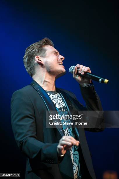 Lee Ryan of Blue performs on stage at LG Arena on December 15, 2013 in Birmingham, United Kingdom.