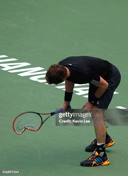 Andy Murray breaks his racket during his match against David Ferrer of Spain during day 5 of the Shanghai Rolex Masters at Zi Zhong stadium on...