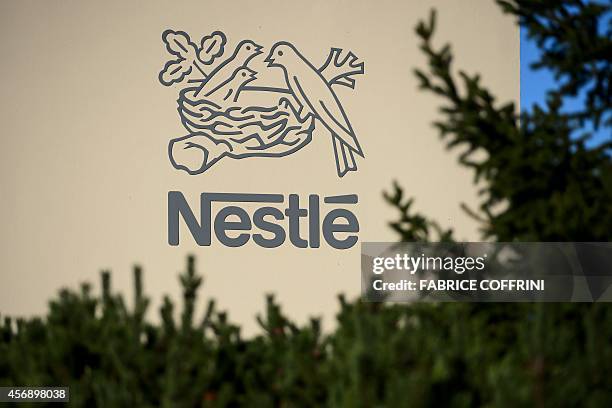 Logo of the world's leading food industry group Nestle is seen on October 9, 2014 at the group's Research Center in Vers-chez-les-Blanc above...