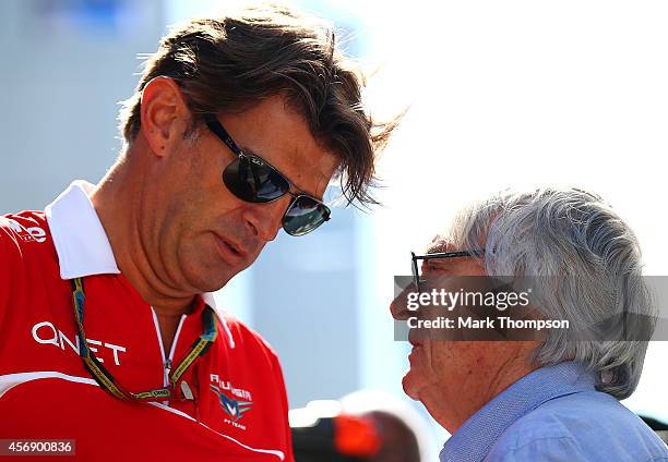 Supremo Bernie Ecclestone speaks with Graeme Lowdon, President and Sporting Director of Marussia in the paddock during previews ahead of the Russian...